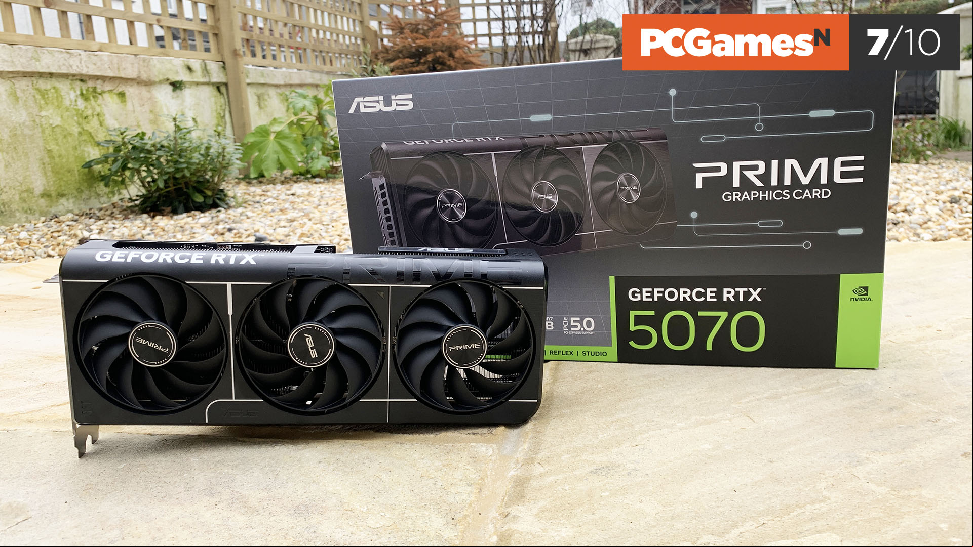 Nvidia GeForce RTX 5070 review: Asus Prime OC graphics card and box with review score.